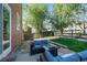 A relaxing patio seating area is featured, with a lush lawn, and plenty of space for entertaining at 11373 Kearney Way, Thornton, CO 80233