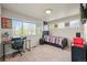 Teen bedroom with a desk, a twin bed with comic themed decor, and a large window at 11373 Kearney Way, Thornton, CO 80233