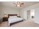 Inviting bedroom with a ceiling fan, comfortable queen bed, and access to the loft area at 11373 Kearney Way, Thornton, CO 80233