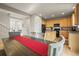 Open concept dining area with wood floors, seamlessly connected to the kitchen and living spaces at 11373 Kearney Way, Thornton, CO 80233