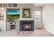 Close up of an inviting fireplace set within a modern entertainment center, complete with a mounted television at 11373 Kearney Way, Thornton, CO 80233