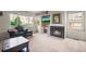 Inviting living room features a cozy fireplace, large windows, and comfortable seating, perfect for relaxation at 11373 Kearney Way, Thornton, CO 80233