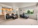 Cozy living room with large windows offering an abundance of natural light and comfortable seating arrangements at 11373 Kearney Way, Thornton, CO 80233