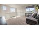 Bright loft area with large windows, neutral carpet and a relaxing seating area at 11373 Kearney Way, Thornton, CO 80233