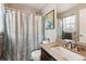 Compact bathroom with a vanity, toilet, and shower with curtain at 1466 Turnberry Dr, Castle Rock, CO 80104