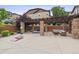 Enjoy this outdoor lounge area with jacuzzi, pergola, stone pillars, seating and games at 1466 Turnberry Dr, Castle Rock, CO 80104