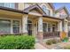 Inviting front porch with stone accents and manicured landscaping creates a warm welcome at 1466 Turnberry Dr, Castle Rock, CO 80104