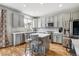 Modern kitchen with stainless steel appliances, ample cabinet space, and a center island at 1466 Turnberry Dr, Castle Rock, CO 80104