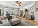Bright and airy living room showcasing an open floor plan and staircase access at 1466 Turnberry Dr, Castle Rock, CO 80104