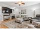 Comfortable living room featuring a cozy fireplace, stylish decor, and ample natural light at 1466 Turnberry Dr, Castle Rock, CO 80104