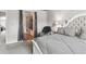 Well-designed bedroom featuring a neutral color palette and adjoining bathroom at 1466 Turnberry Dr, Castle Rock, CO 80104