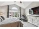 Comfortable bedroom with vaulted ceiling, large windows, and soft carpeting at 1466 Turnberry Dr, Castle Rock, CO 80104