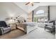 Bright main bedroom featuring a vaulted ceiling, large window, and neutral decor at 1466 Turnberry Dr, Castle Rock, CO 80104