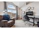 Home office featuring a large window, a comfortable chair, and a modern desk at 1466 Turnberry Dr, Castle Rock, CO 80104