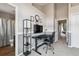 Well-lit home office with wainscotting featuring a sleek desk setup, and storage at 1466 Turnberry Dr, Castle Rock, CO 80104