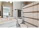 Well-lit bathroom featuring a shower and modern fixtures, creating a sleek, clean space at 6737 S Tempe Ct, Aurora, CO 80016