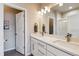 Bright bathroom with a double sink, modern vanity, and elegant fixtures at 6737 S Tempe Ct, Aurora, CO 80016