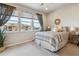 Bright bedroom with large windows, a cozy bed, and a leafy green plant near the corner at 6737 S Tempe Ct, Aurora, CO 80016