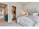 Comfortable bedroom with carpet, stylish decor, and ensuite access to a bathroom at 6737 S Tempe Ct, Aurora, CO 80016