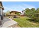 Beautiful backyard showcasing a gazebo, patio, and well-maintained lawn, creating a perfect outdoor living space at 12616 Jersey W Cir, Brighton, CO 80602
