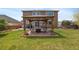 Inviting backyard showcasing a cozy gazebo with a seating area, perfect for relaxing and enjoying the outdoors at 12616 Jersey W Cir, Brighton, CO 80602