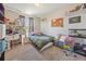 Bedroom with a window, a desk, and fun decor at 12616 Jersey W Cir, Brighton, CO 80602