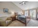 Comfortable bedroom featuring a large bed, nightstands, and natural light at 12616 Jersey W Cir, Brighton, CO 80602