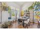 Bright dining room filled with natural light and featuring stylish decor and hardwood floors at 12616 Jersey W Cir, Brighton, CO 80602