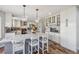 Spacious kitchen with white cabinets, a large island, granite countertops and stainless steel appliances at 12616 Jersey W Cir, Brighton, CO 80602