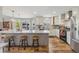 Updated kitchen features granite island, stainless appliances, plenty of counter space and a view to the backyard at 12616 Jersey W Cir, Brighton, CO 80602