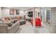 Cozy living room with a large sectional sofa and a flat-screen TV at 12616 Jersey W Cir, Brighton, CO 80602