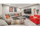 Basement Living Room with sofa, flat screen tv and a neutral color palette at 12616 Jersey W Cir, Brighton, CO 80602