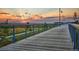 Scenic walking path with views of the sunset, showcasing a vibrant, active community lifestyle at 21166 E 62Nd Dr, Aurora, CO 80019