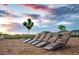 Relaxing outdoor lounge area with wooden chaise loungers, perfect for enjoying the sunset at 21166 E 62Nd Dr, Aurora, CO 80019