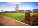 Landscaped lawn and signage for Periwinkle Park, part of a community surrounded by attractive multi-story homes at 21166 E 62Nd Dr, Aurora, CO 80019