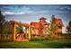 Creative play structure with picnic table under a pergola, nestled in a Gathering-friendly community park at 21166 E 62Nd Dr, Aurora, CO 80019