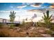 Vibrant community playground featuring a slide and bridge, complemented by beautiful sunset views at 21166 E 62Nd Dr, Aurora, CO 80019