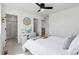 Bedroom with a study nook, neutral decor and an ensuite bathroom with a white shower at 503 S Rollie Ave # 12D, Fort Lupton, CO 80621