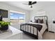 Bright and airy bedroom with a comfortable bed, ceiling fan, and sunny window at 503 S Rollie Ave # 12D, Fort Lupton, CO 80621