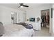Serene bedroom featuring a walk-in closet, modern furnishings, and neutral decor at 503 S Rollie Ave # 12D, Fort Lupton, CO 80621