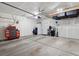 Spacious two car garage with lots of storage and a refrigerator at 503 S Rollie Ave # 12D, Fort Lupton, CO 80621