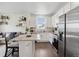 Modern kitchen features stainless steel appliances, granite countertops, and a breakfast bar at 503 S Rollie Ave # 12D, Fort Lupton, CO 80621