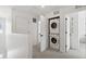 Second story laundry closet with stacked washer and dryer at 503 S Rollie Ave # 12D, Fort Lupton, CO 80621