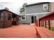 Spacious wooden back deck with gazebo and built-in bench seating perfect for outdoor relaxation and entertaining at 7334 S Moore St, Littleton, CO 80127