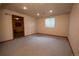 Finished basement featuring recessed lighting, neutral carpeting, and natural light at 7334 S Moore St, Littleton, CO 80127