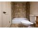 Bathroom featuring tile shower and floors for a clean and modern look at 7334 S Moore St, Littleton, CO 80127