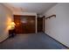 Bedroom featuring plush carpeting, spacious closet, and neutral walls at 7334 S Moore St, Littleton, CO 80127