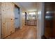 Hallway leading to bathroom with beautiful wooden cabinets and granite countertops at 7334 S Moore St, Littleton, CO 80127