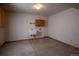 Functional laundry room with utility sink and cabinets for storage at 7334 S Moore St, Littleton, CO 80127