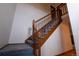 Carpeted staircase featuring wood railing and natural light at 7334 S Moore St, Littleton, CO 80127